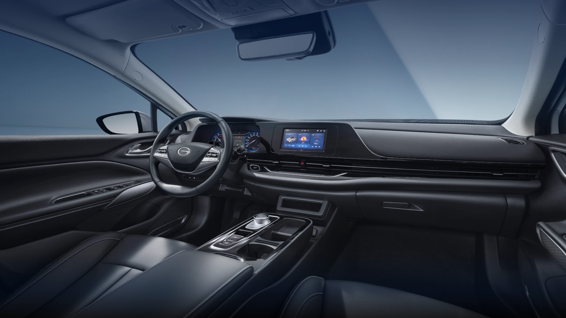 Interior do GAC AION ES — painel, volante e central multimídia